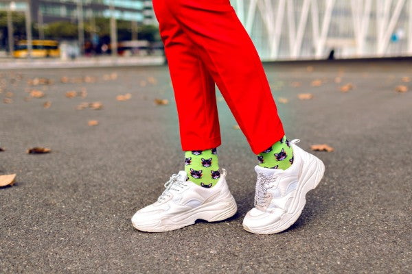 White sneakers with red pants